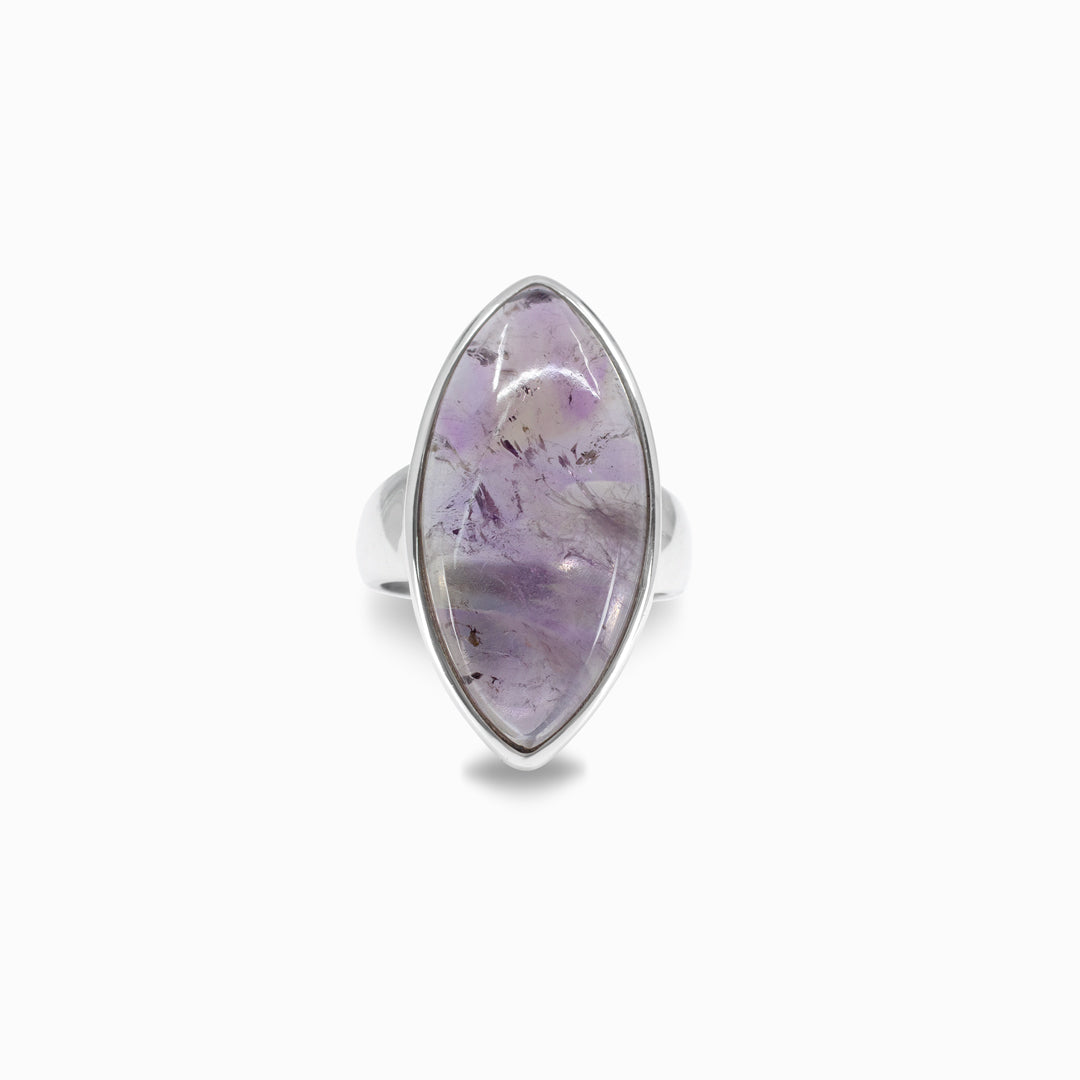 Silver ring with a purple stone on a white background