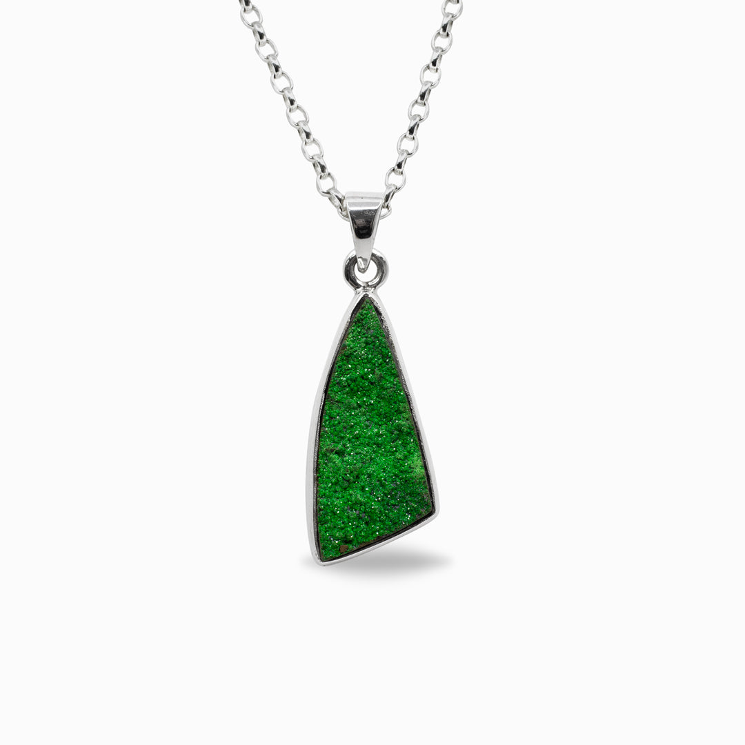 Green freeform pendant necklace on a white background
