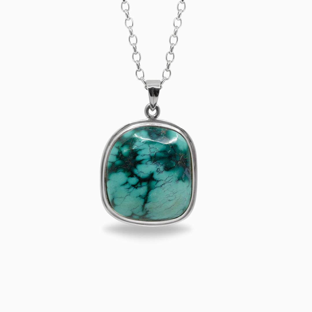 Turquoise pendant on a white background