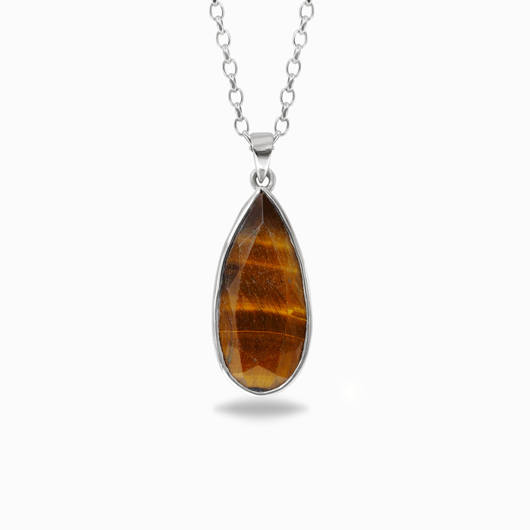 Teardrop-shaped Tiger's Eye pendant on a silver chain against a white background
