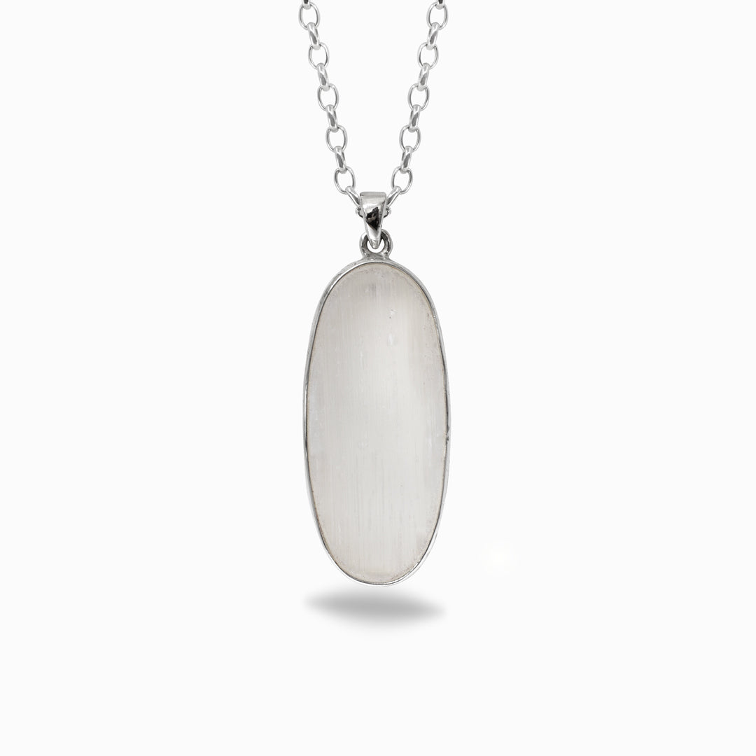Silver necklace with a white oval pendant on a white background