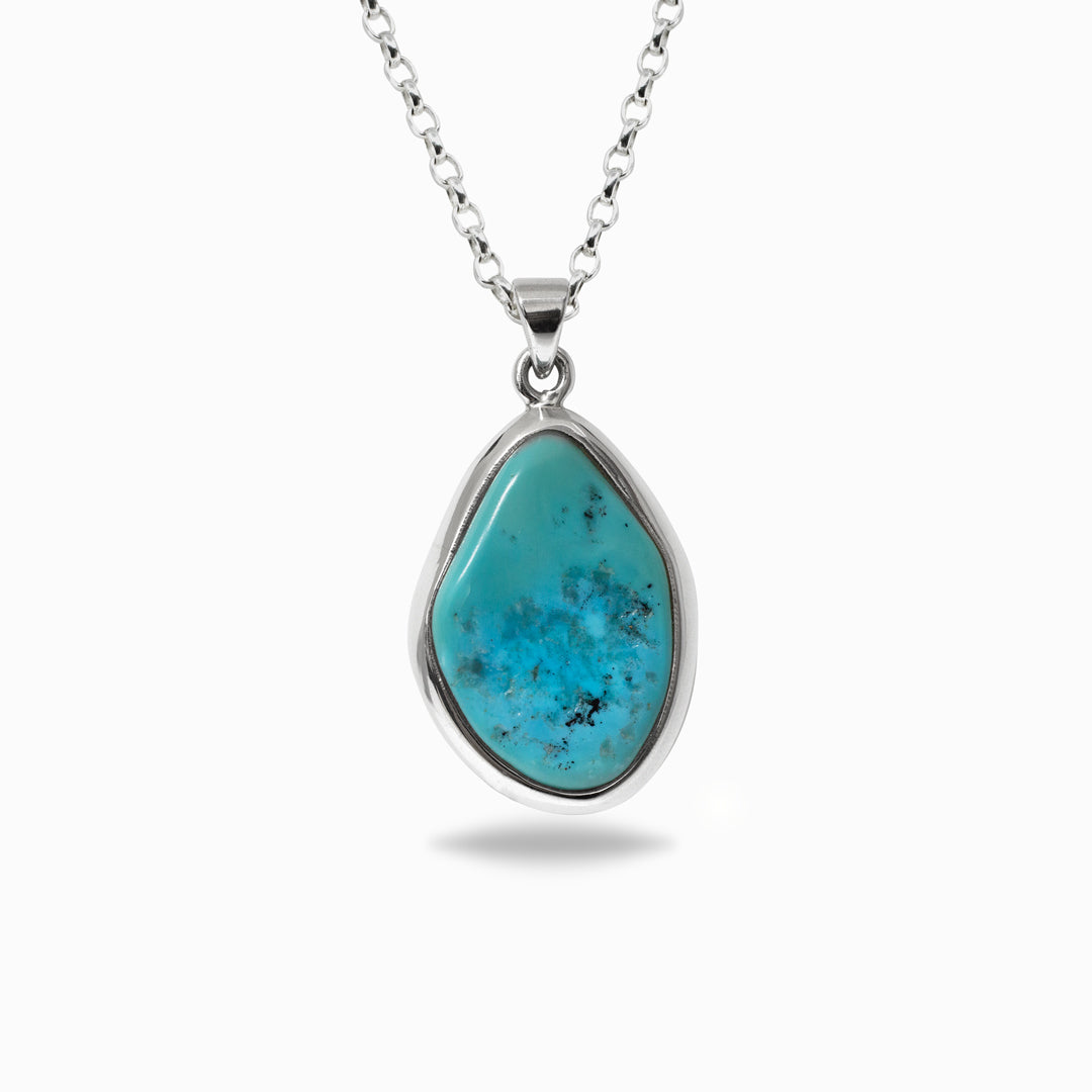 Turquoise pendant necklace on a white background