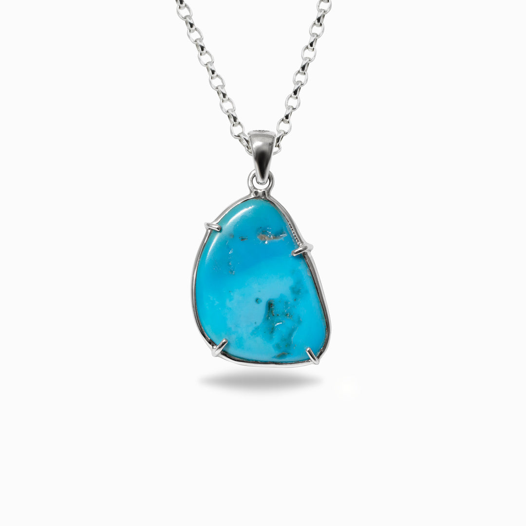 Turquoise pendant necklace on a white background