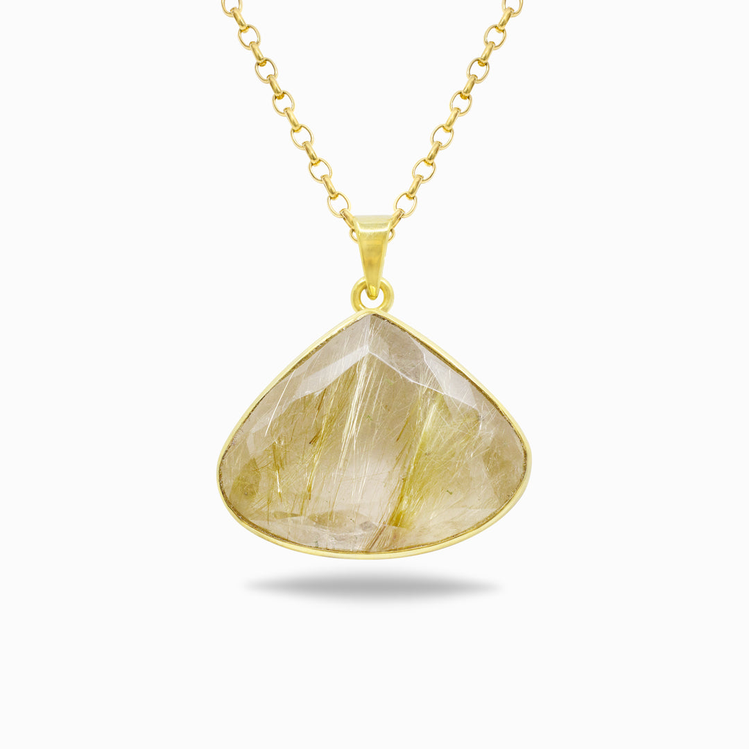 Golden necklace with a clear stone on a white background