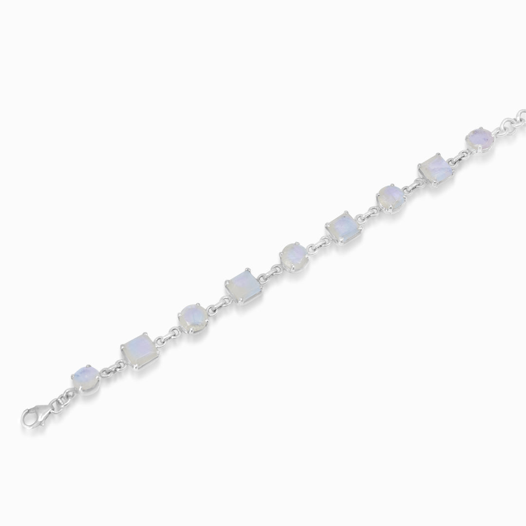 Silver bracelet with round and square-shaped gemstones on a white background