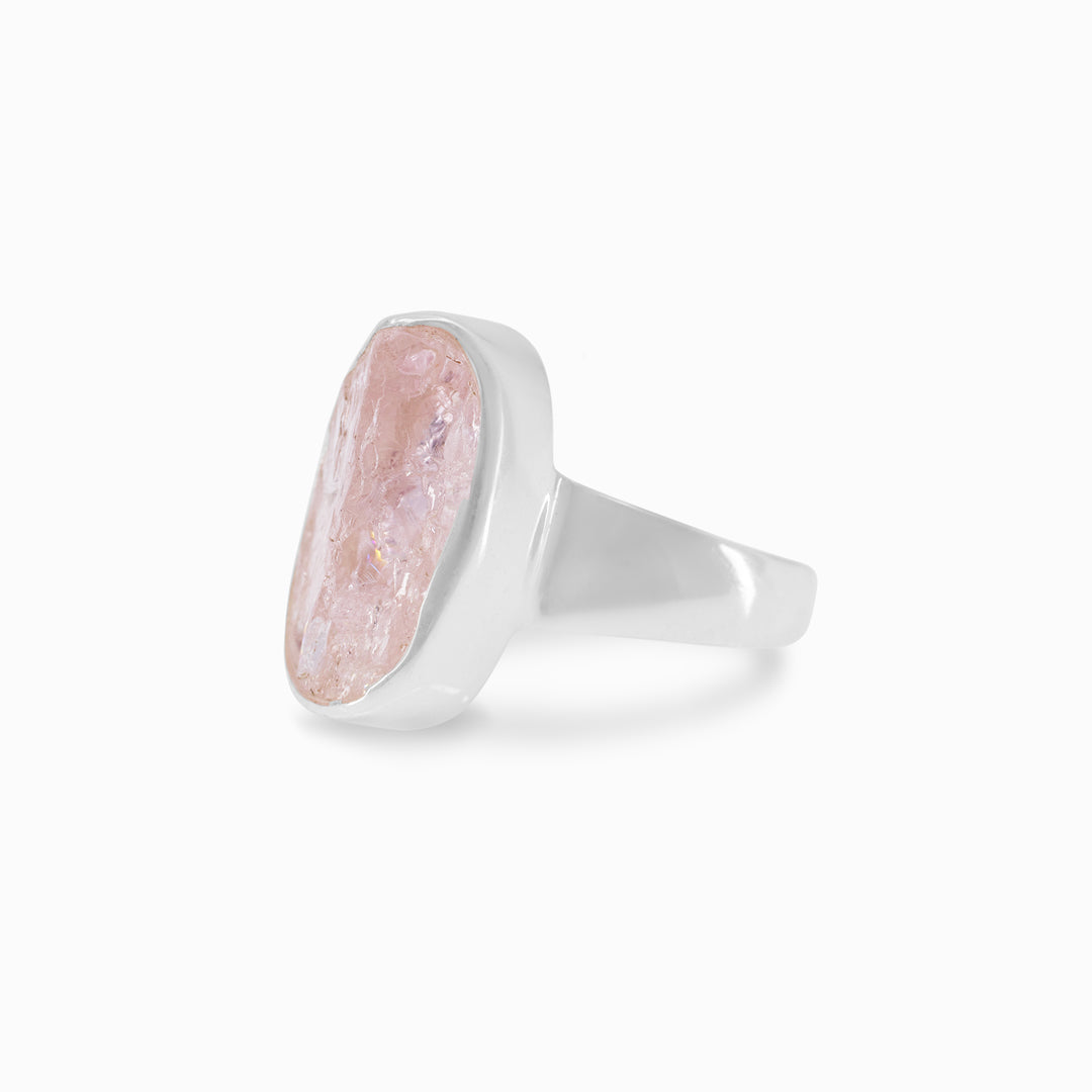 Silver ring with a pink stone on a white background