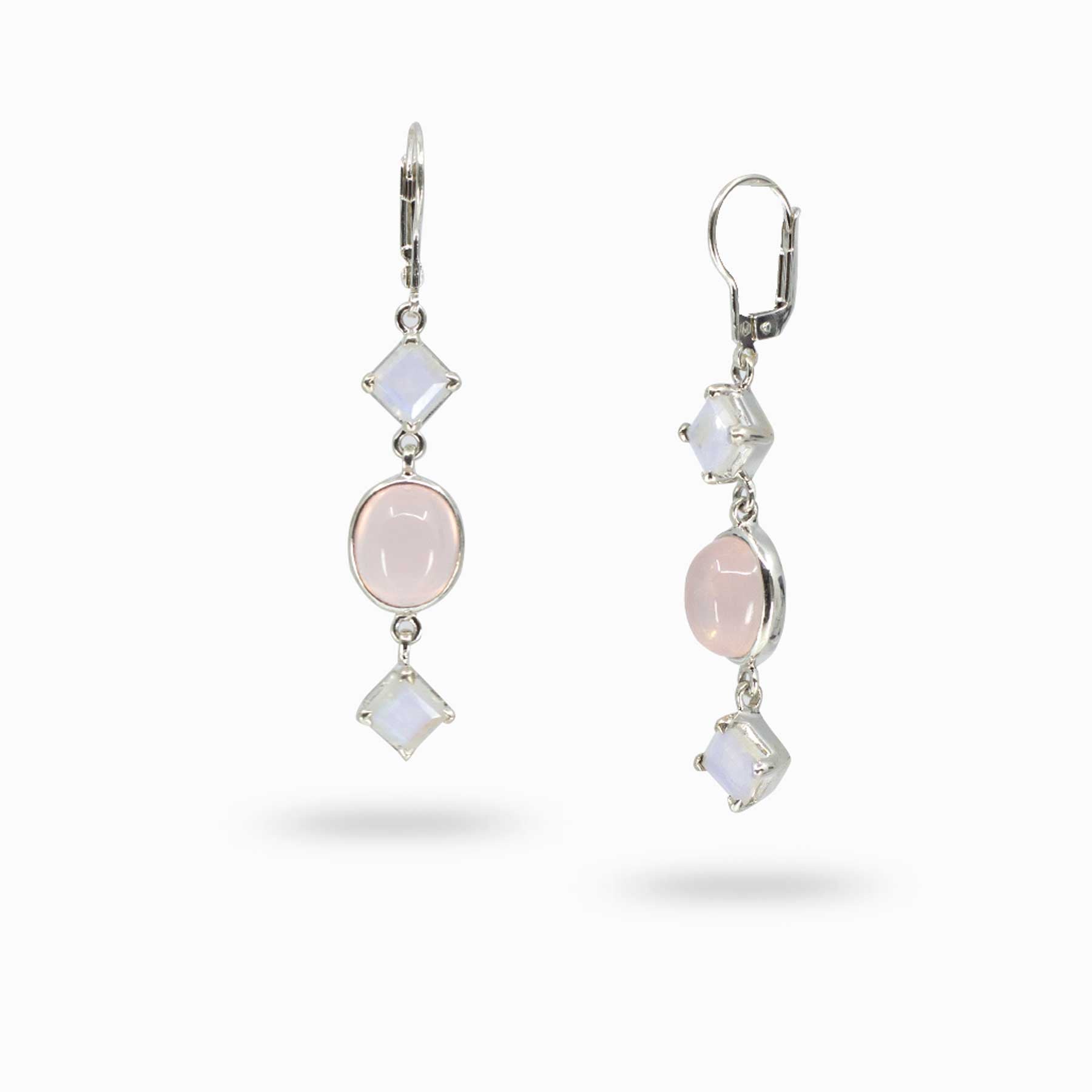 Pair of silver drop earrings with pink and iridescent gemstones on a white background