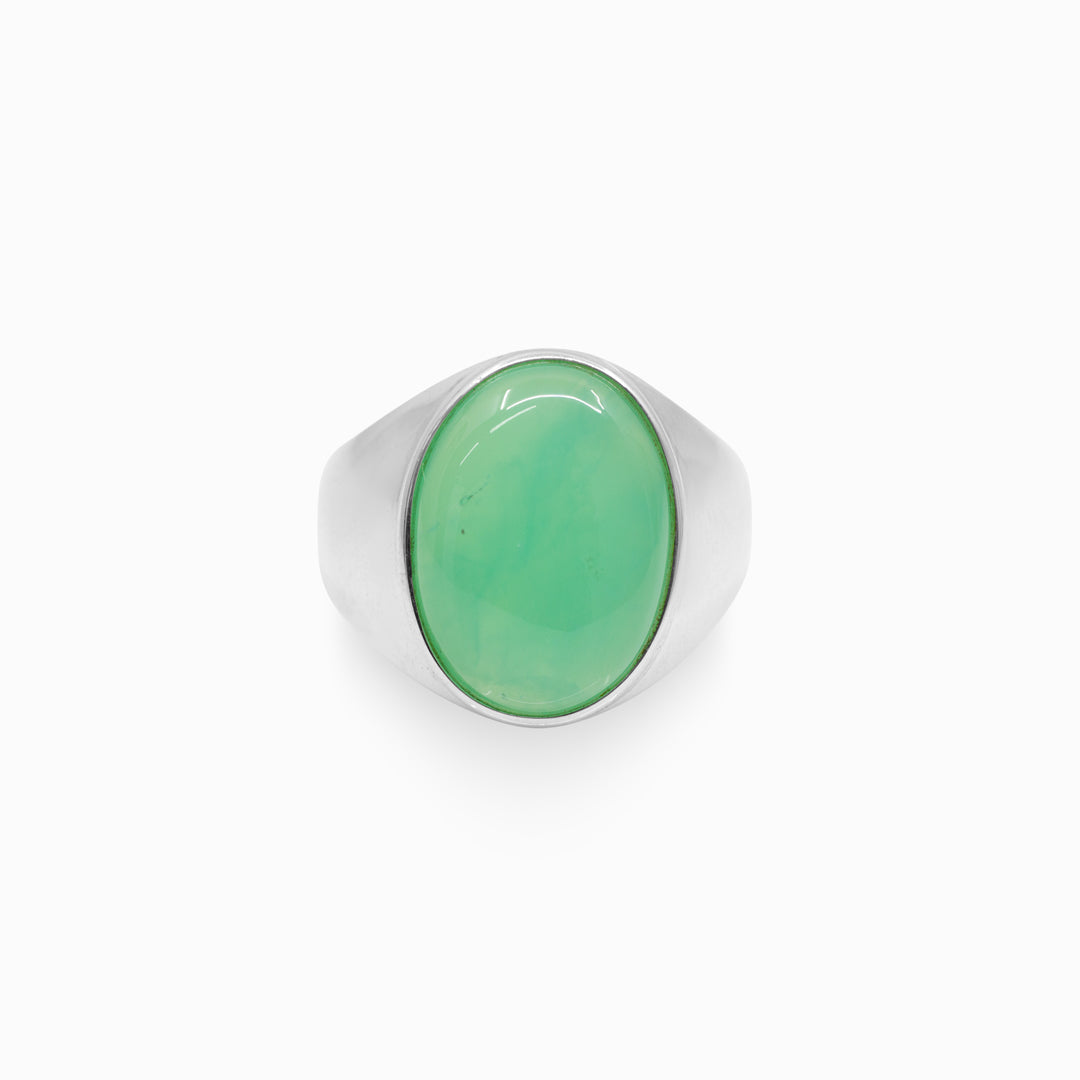 Silver ring with a green gemstone on a white background