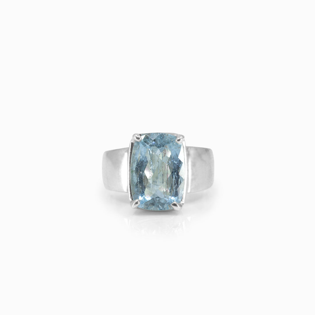 Silver ring with a blue gemstone on a white background
