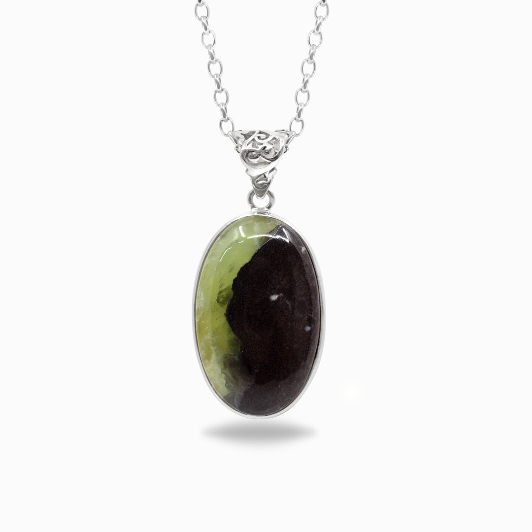 Silver necklace with a green and brown oval pendant on a white background