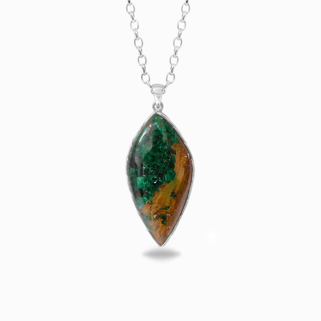 Silver necklace with a pendant featuring green and brown stone on a white background