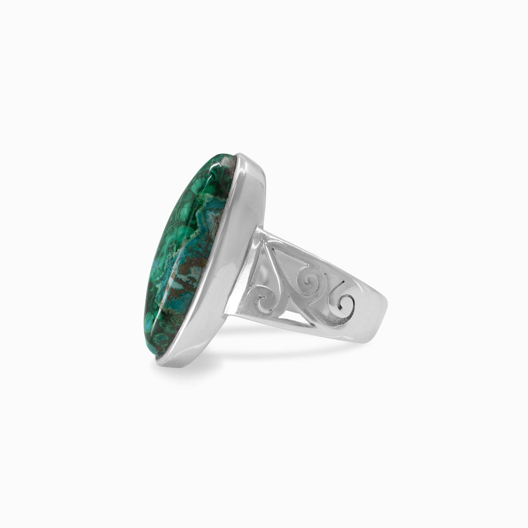 Silver ring with a blue and green gemstone on a white background