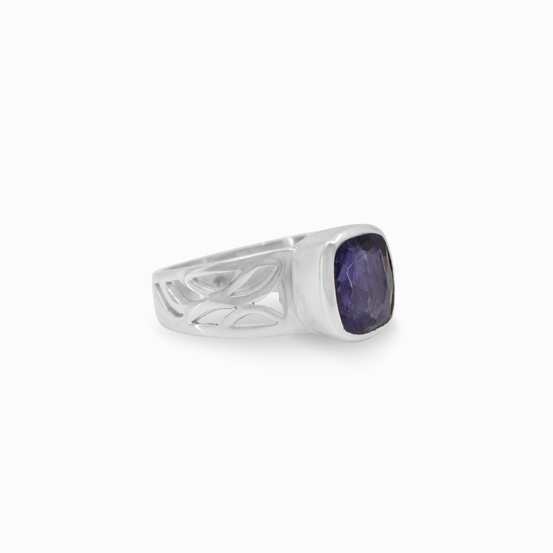 Silver ring with a violet gemstone on a white background