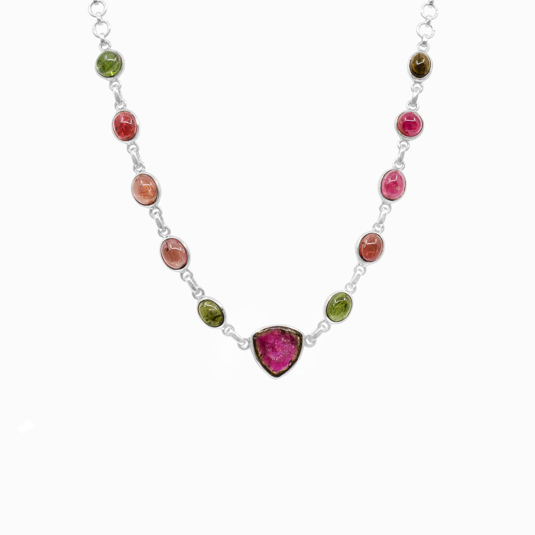 Silver necklace with multicolored gemstones on a white background