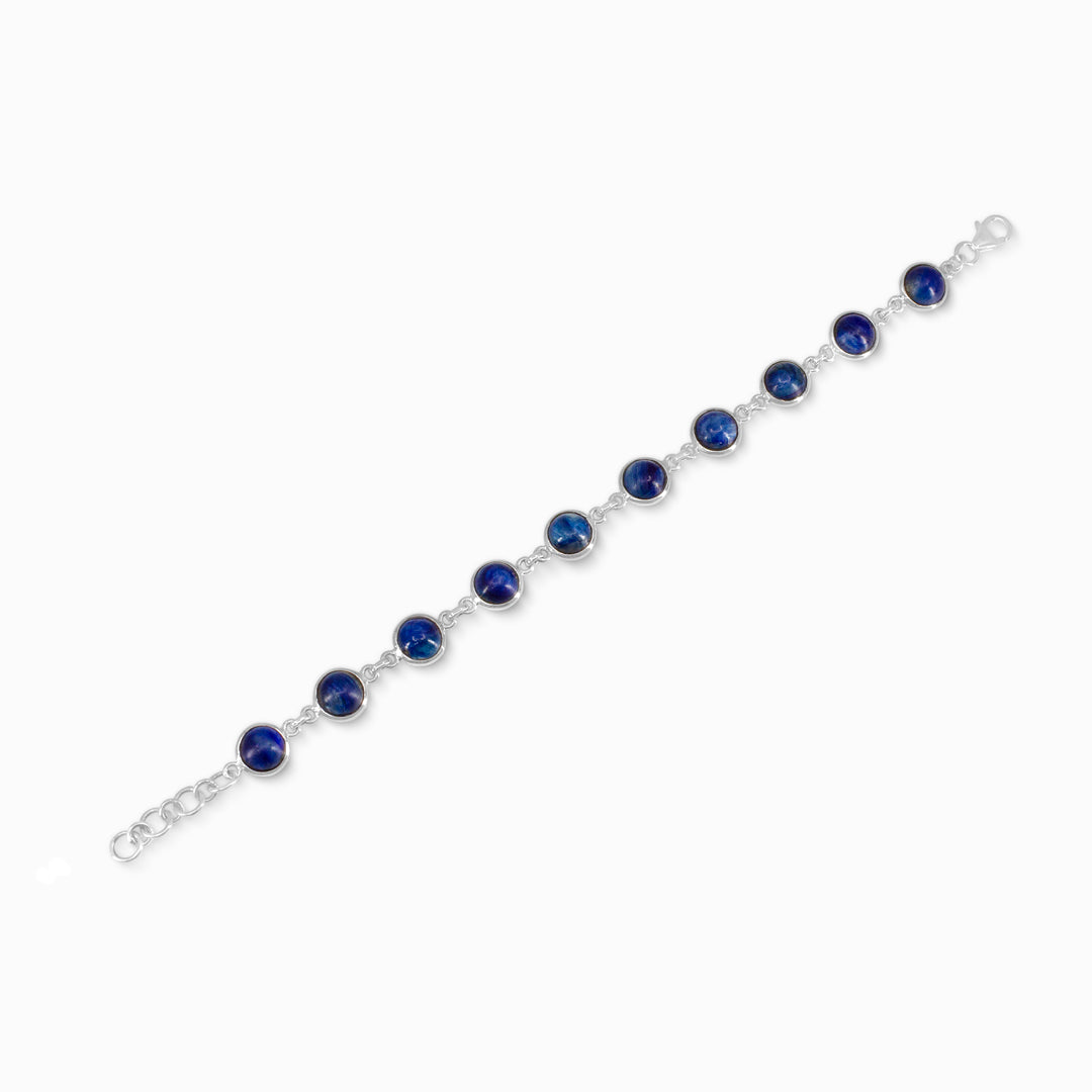 Silver bracelet with blue stones on a white background