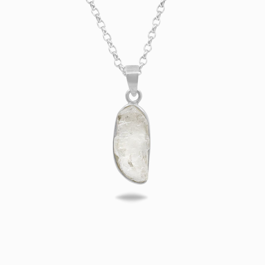 Silver necklace with a clear gemstone on a white background