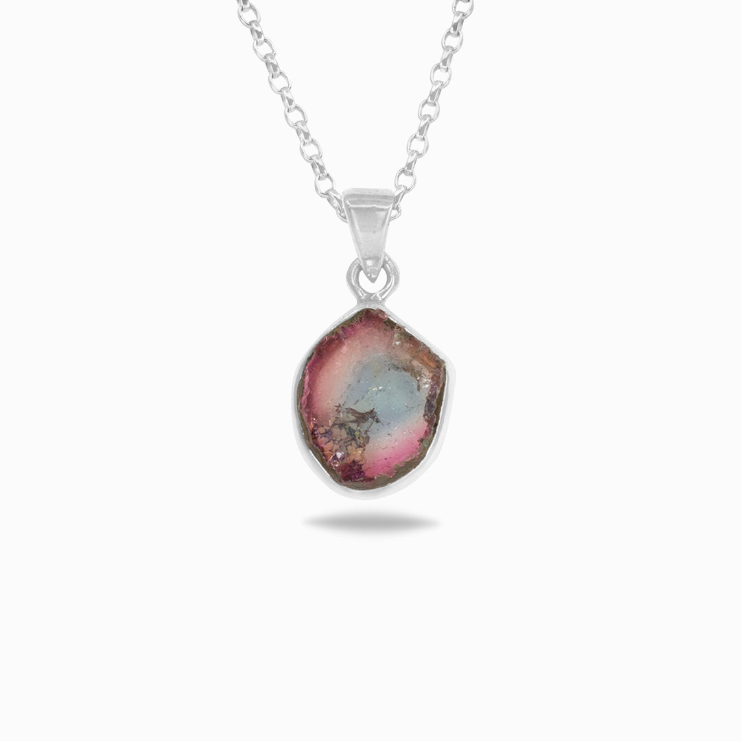 Necklace with a pendant featuring a pink and green stone on a white background