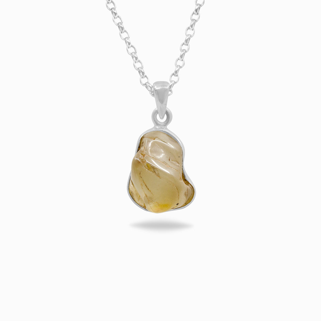 Silver necklace with a freeform gemstone on a white background