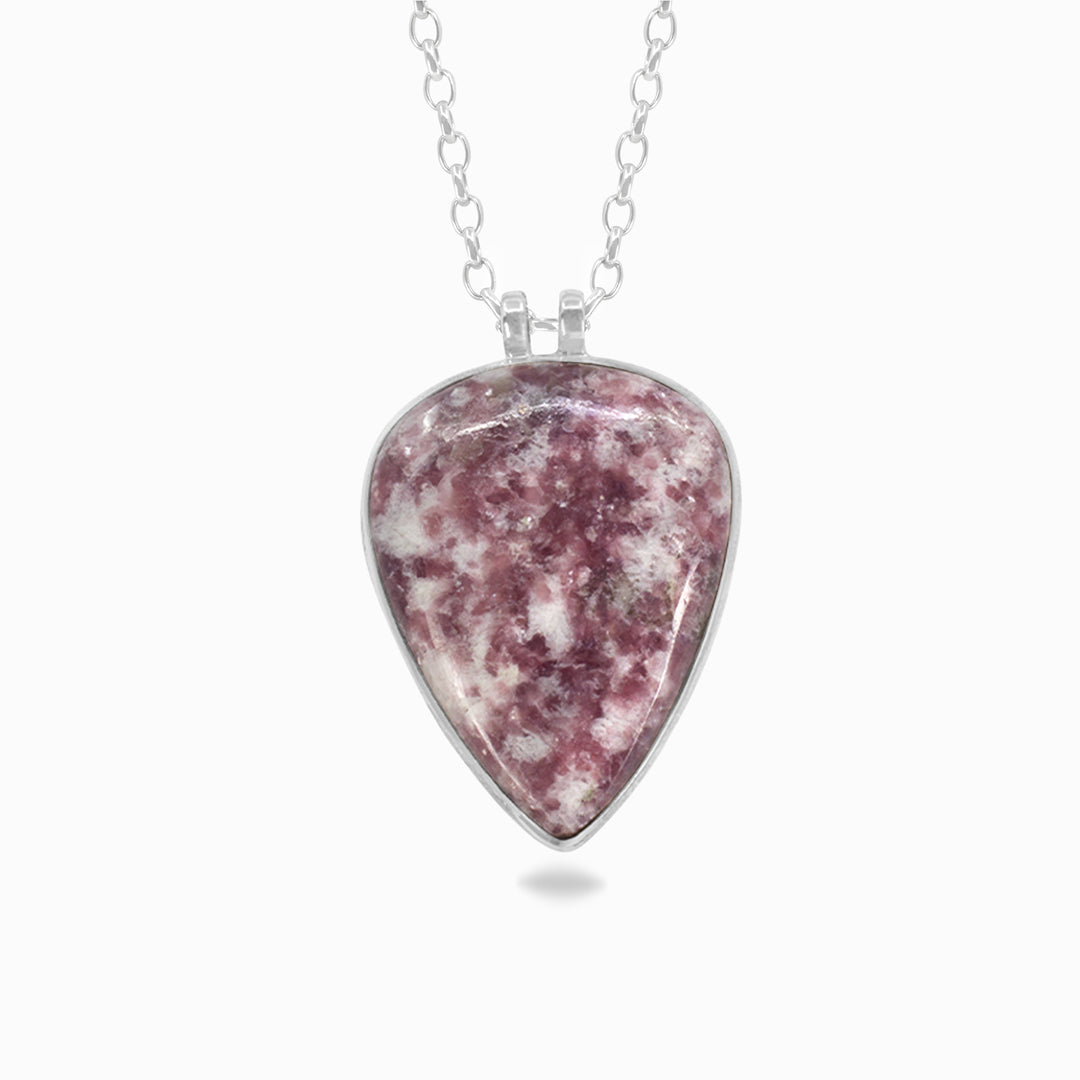 Silver necklace with pink and white stone on a white background