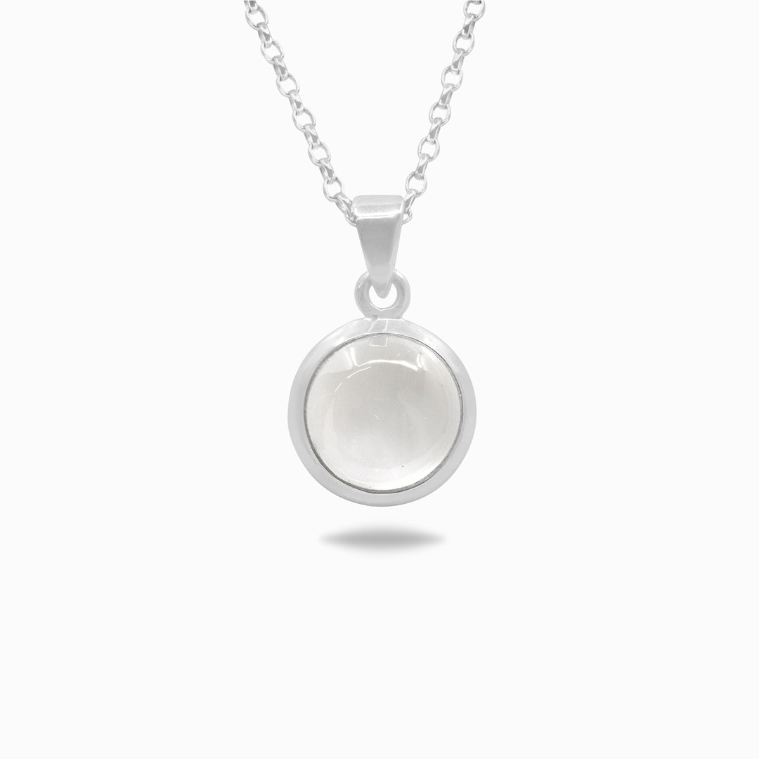Silver necklace with a clear gemstone on a white background