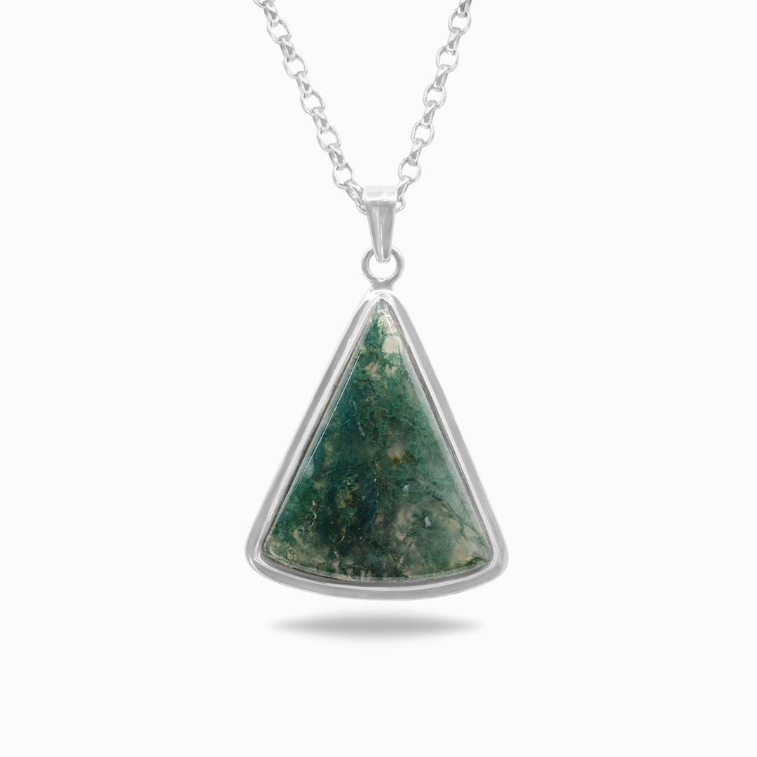 Silver necklace with translucent gemstone with green inclusions on a white background