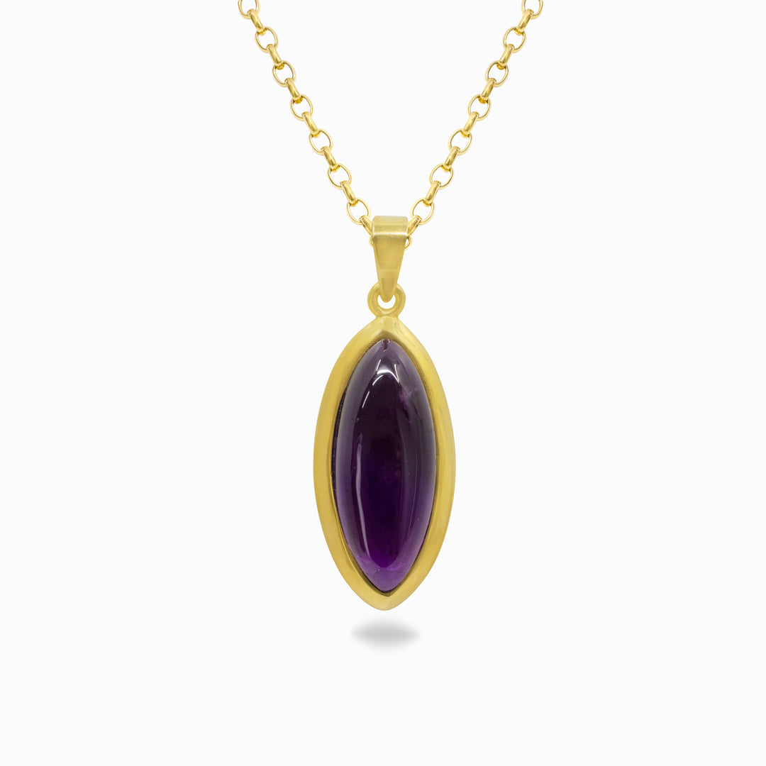 Gold necklace with a purple gemstone on a white background