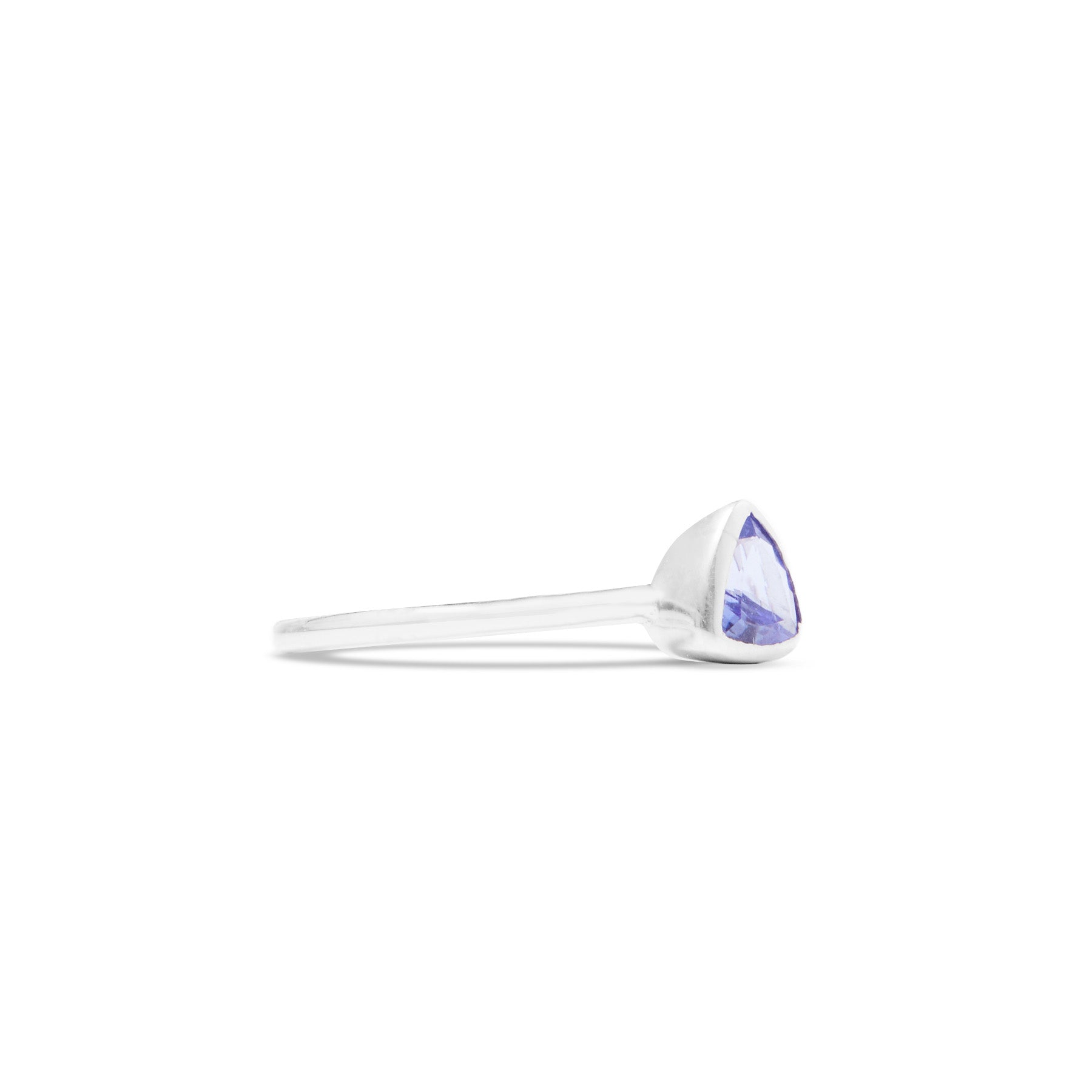 Silver ring with a blue gemstone on a white background