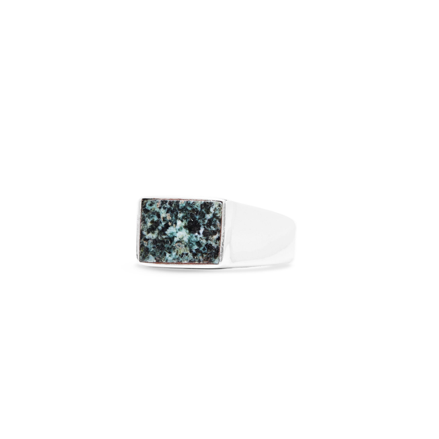 Silver ring with a rectangular green stone on a white background