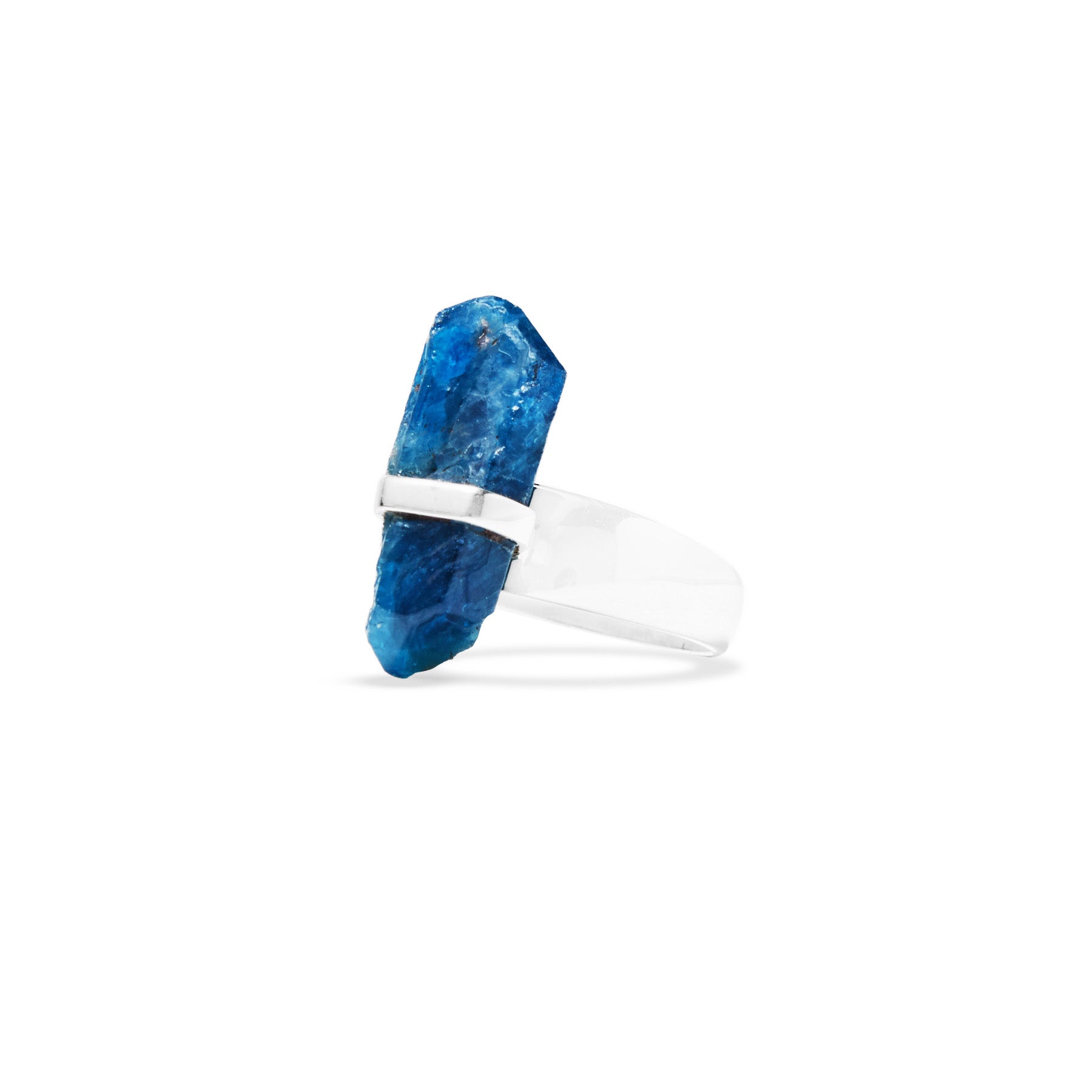 Silver ring with a blue gemstone on a white background.