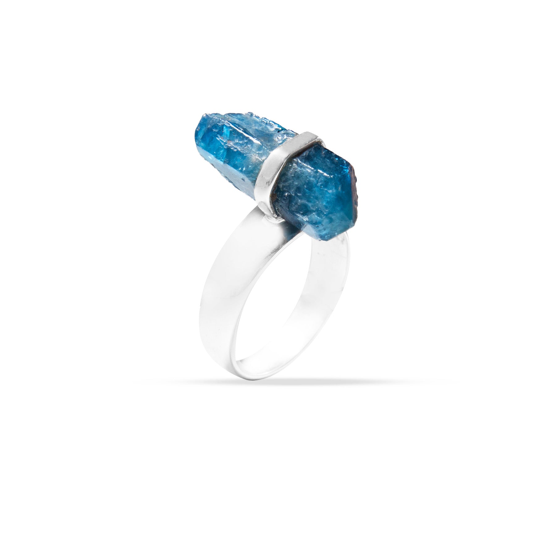 Silver ring with a blue gemstone on a white background.