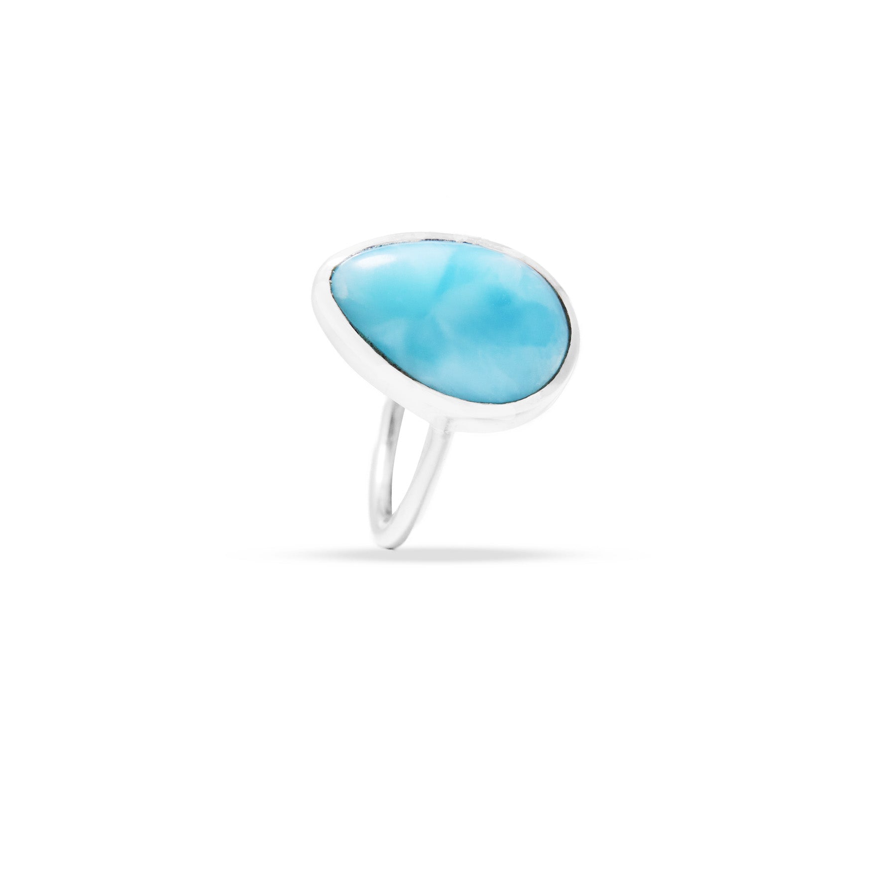 Silver ring with a light blue stone on a white background