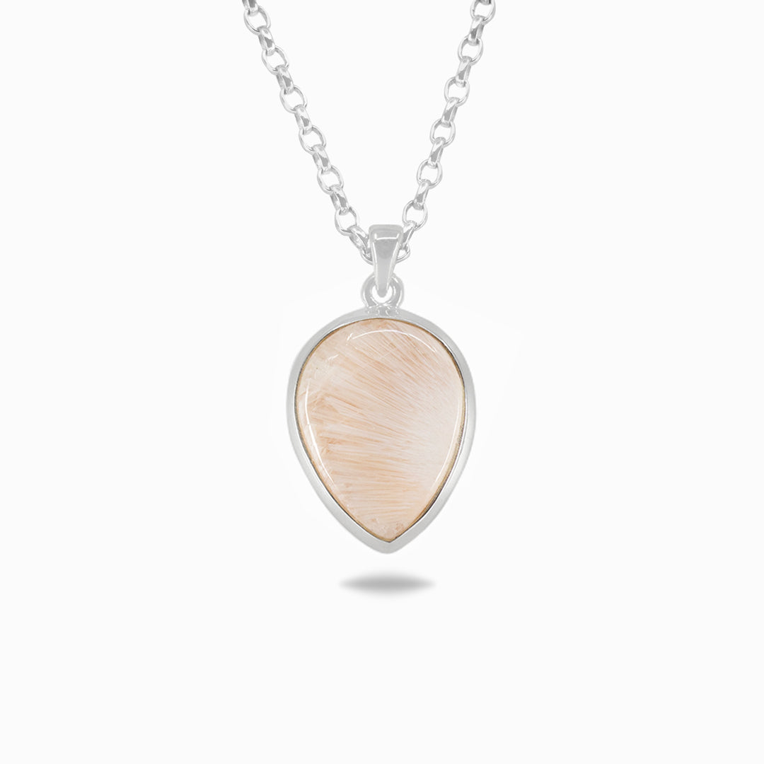 Silver necklace with a light pink gemstone on a white background.