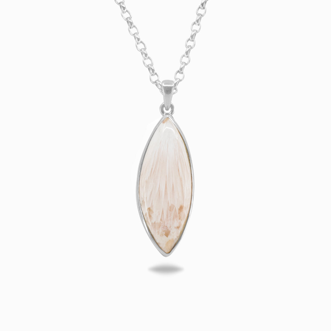 Silver necklace with a light pink gemstone on a white background.
