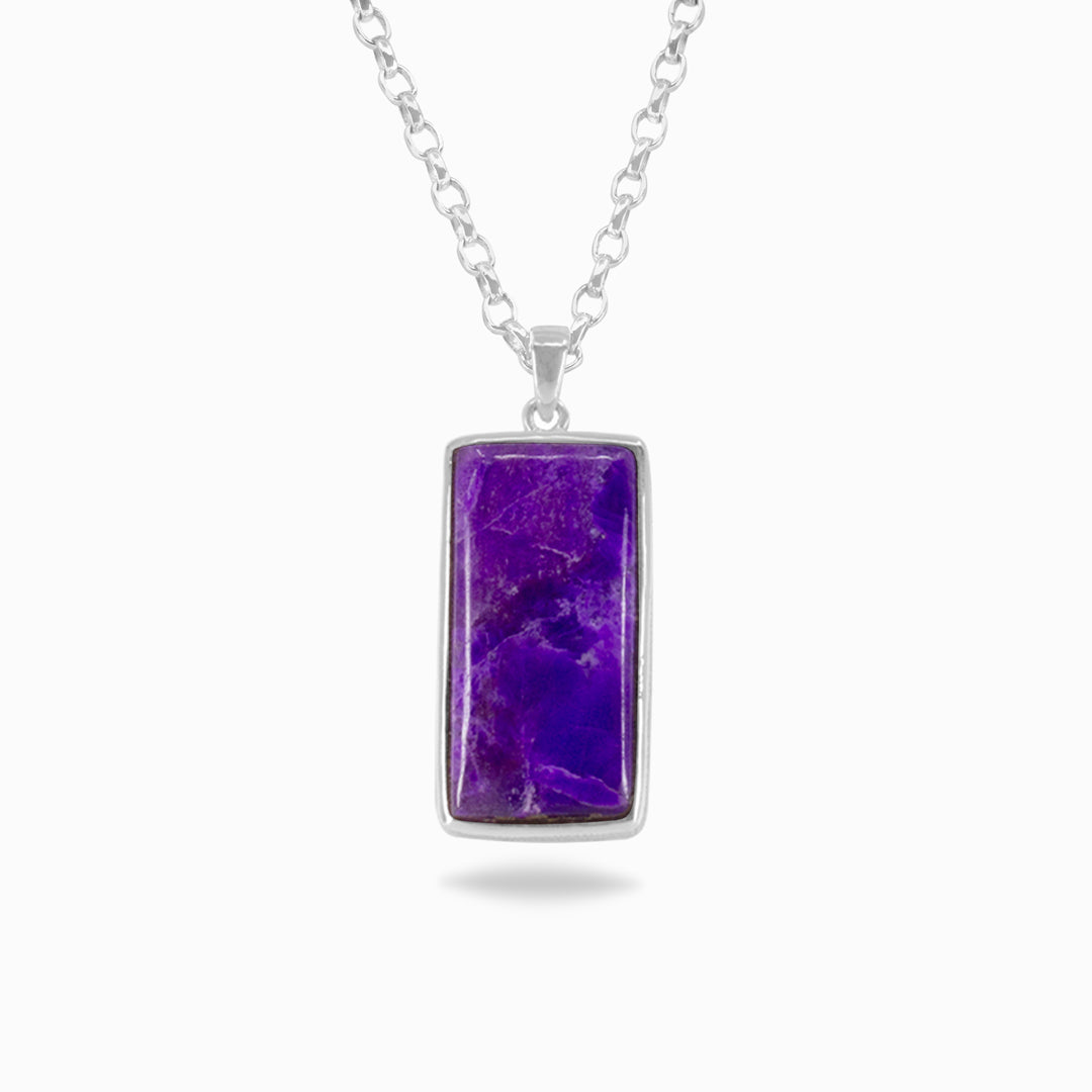 Silver necklace with purple gemstone on a white background.