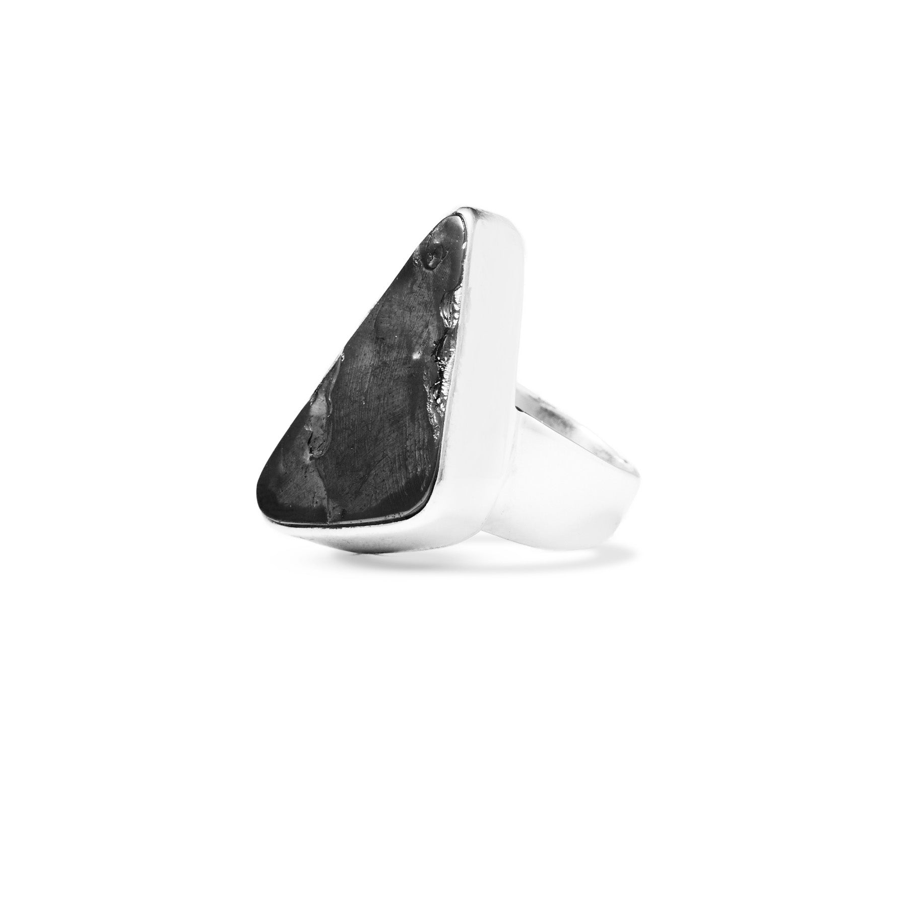Silver ring with a black metallic stone on a white background
