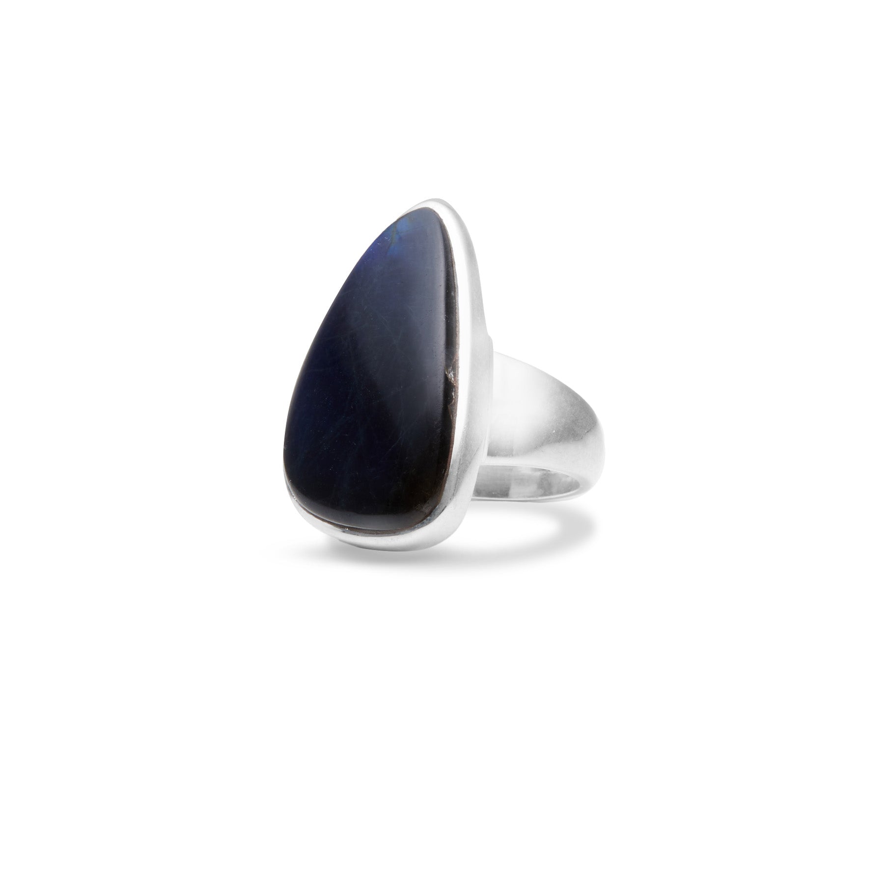 Silver ring with a dark blue gemstone on a white background