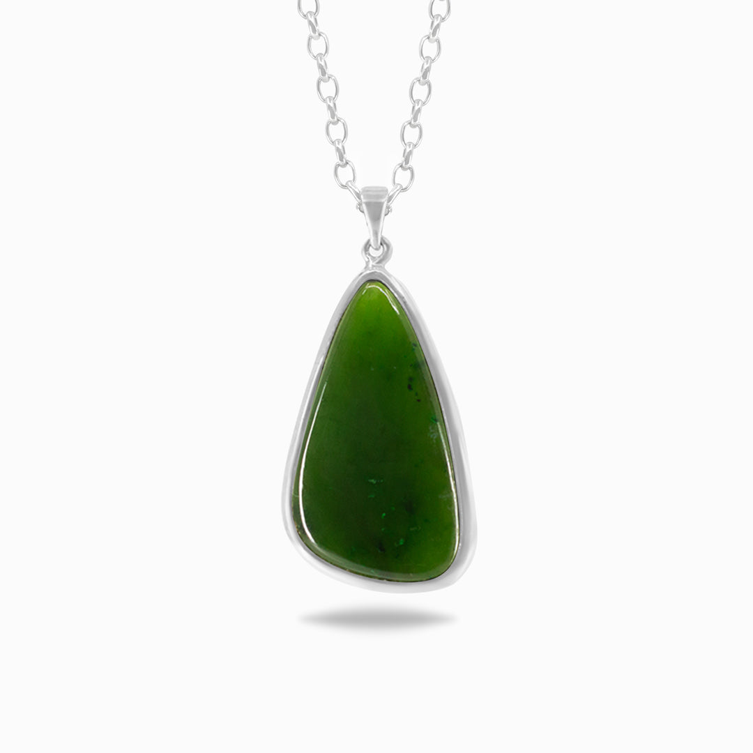 Silver necklace with a green stone on a white background.