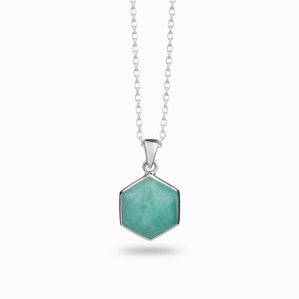 Light teal, hexagon shaped crystal, cabochon cut & 925 sterling silver bezel set on a 925 sterling silver chain.