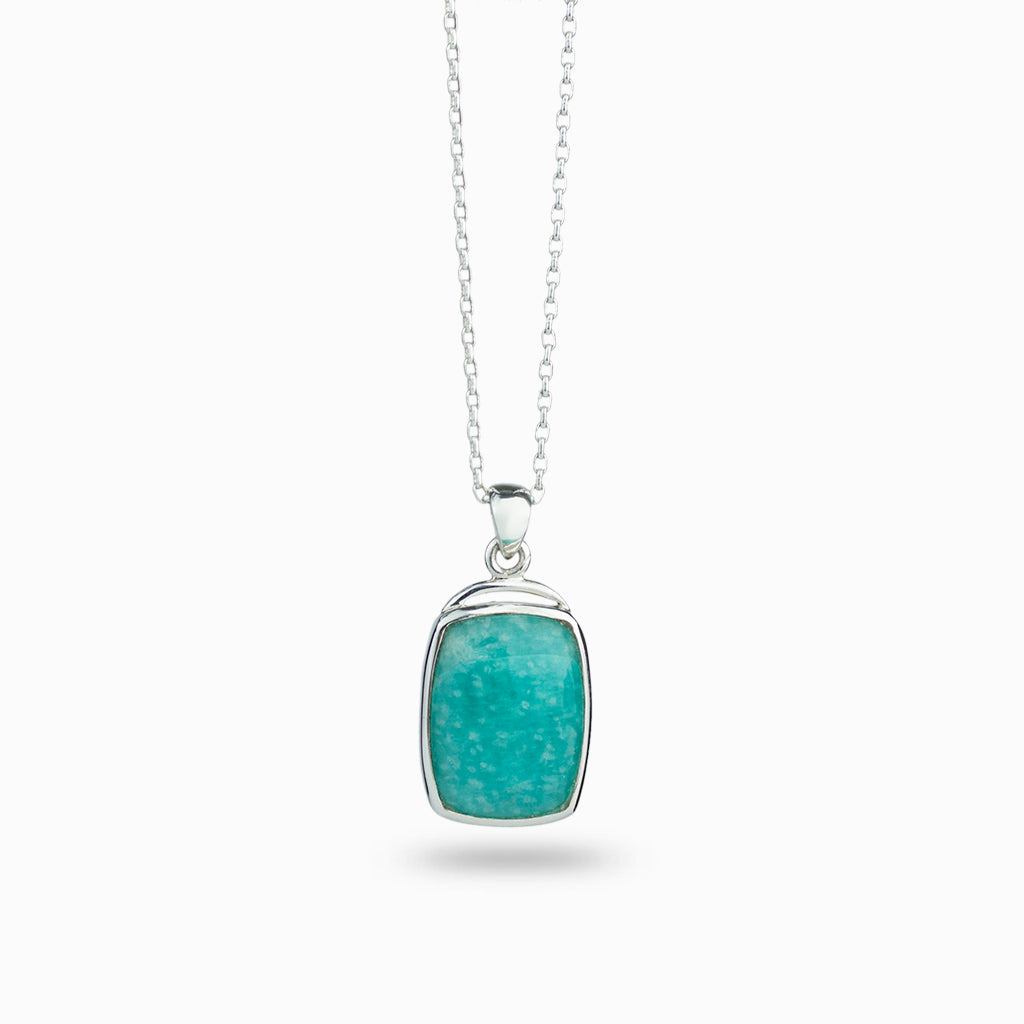 teal coloured crystal with faint white spots, cabochon & 925 sterling silver bezel set on a 925 sterling silver chain.