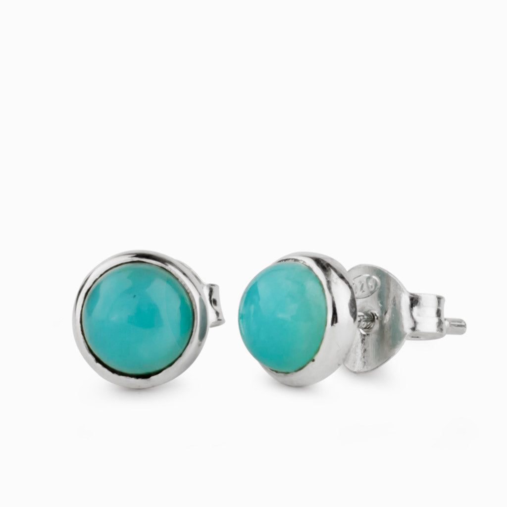 Teal, cabochon studs set in 925 sterling silver.