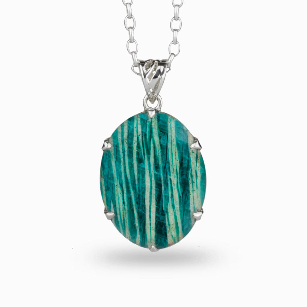pale green lines on teal coloured oval crystal, 925 sterling silver claw set on a 925 sterling silver chain