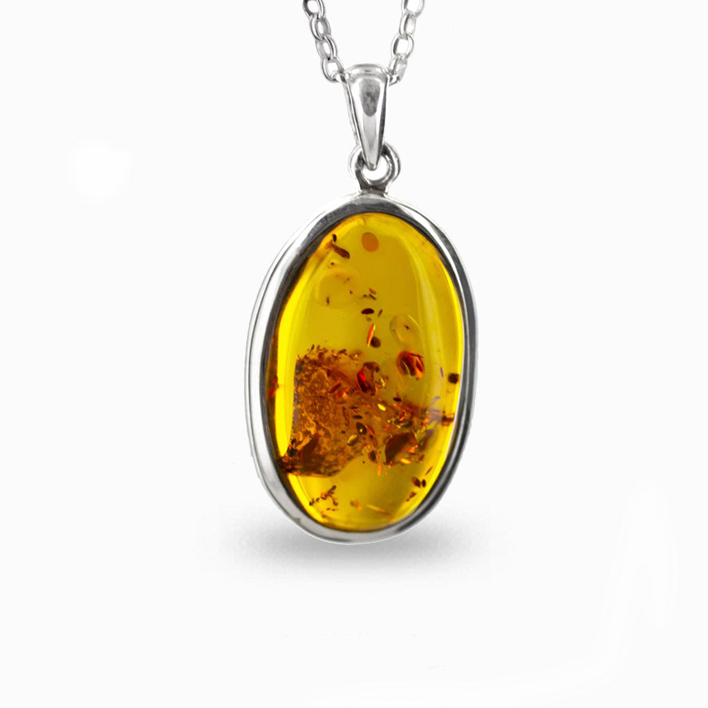 yellow with details, cabochon, oval, bezel set 