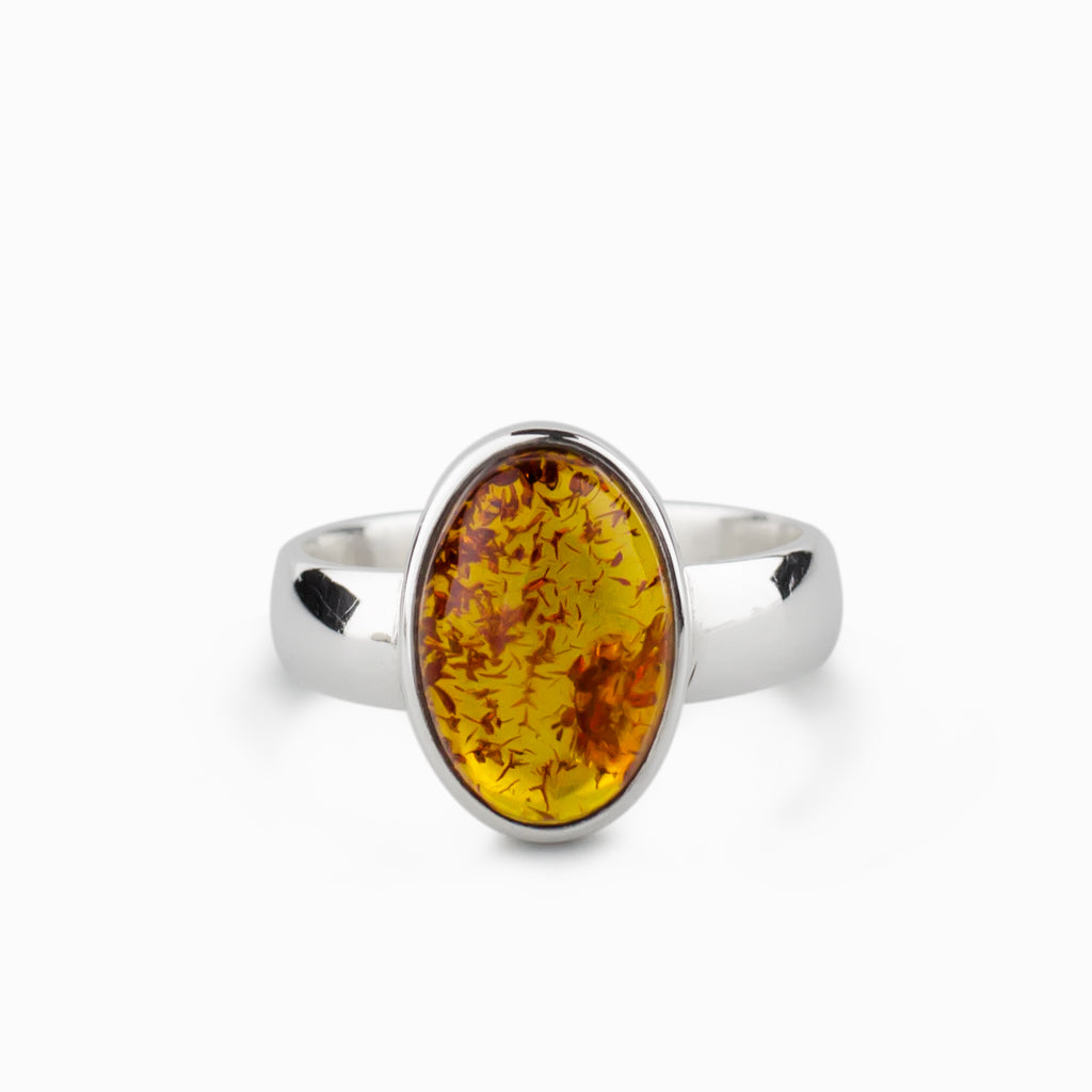 yellow with fiery red details. round, cabochon bezel set